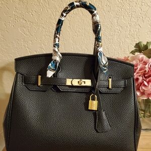 Elegant Black Handbag with Gold Accents